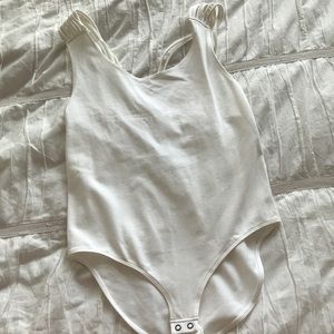 Strappy white one piece body suit
